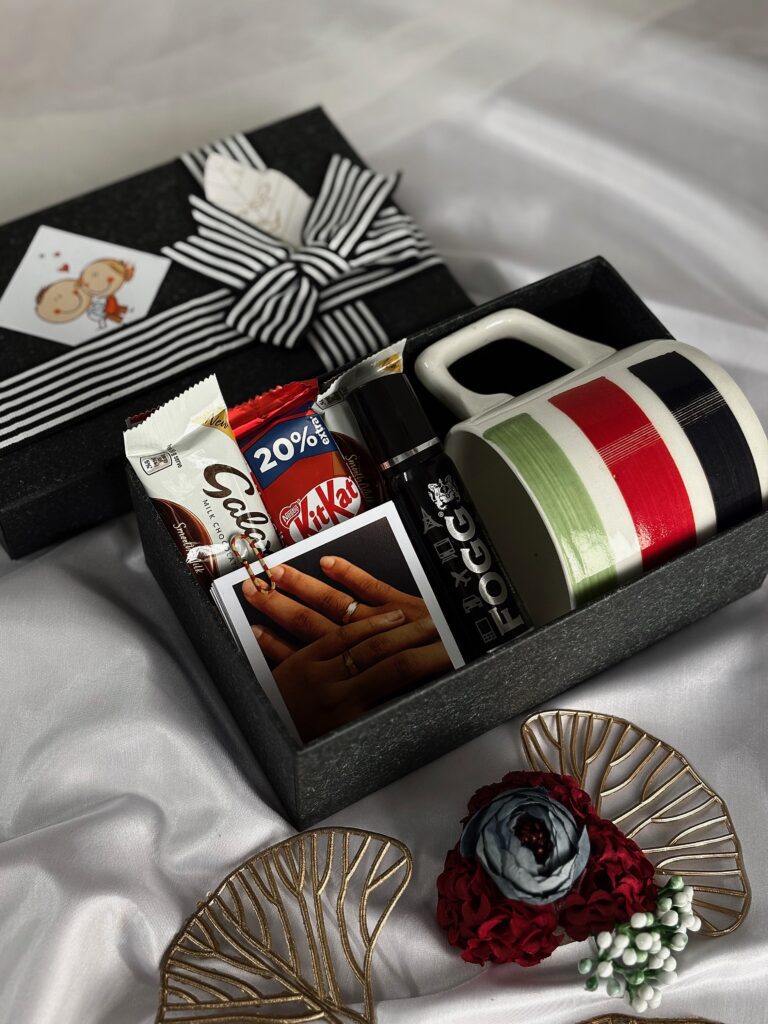 black classy gift box with mug, photos and chocolate