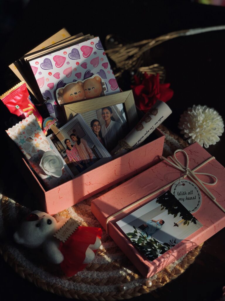 pink hamper box with many handmade gift items