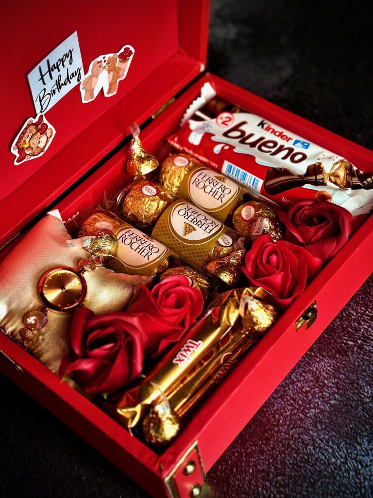 red womens hamper box with premium chocolates, luxury watch, flowers with customisation