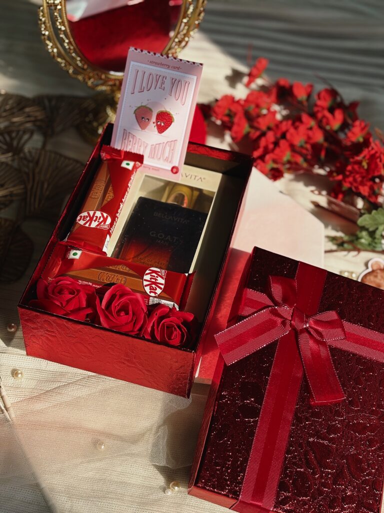 red colour luxury box with bellavita perfume, chocolates and flowers