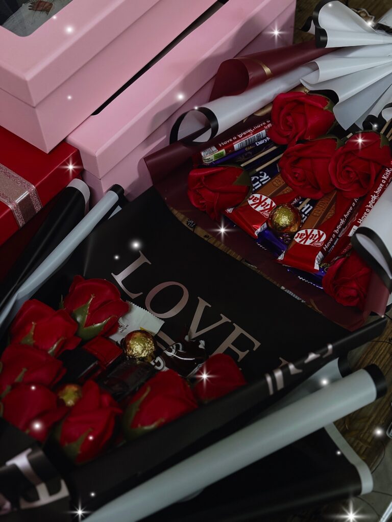 models of bouquet with cars, flowers and chocolates