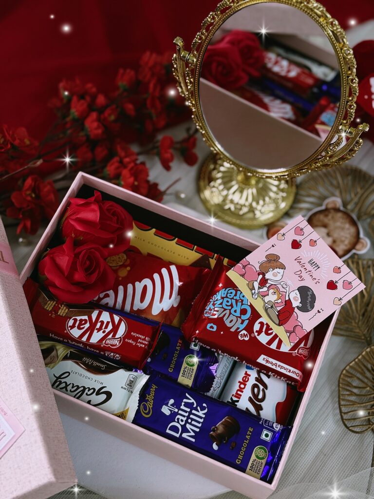 Chocolate overload gift hamper with assorted chocolates, candies, and snacks in a red box