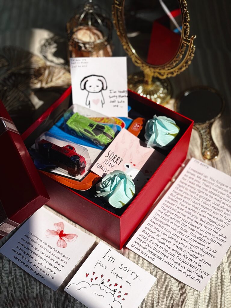 hamper with hotwheels, flowers and sorry notes for men