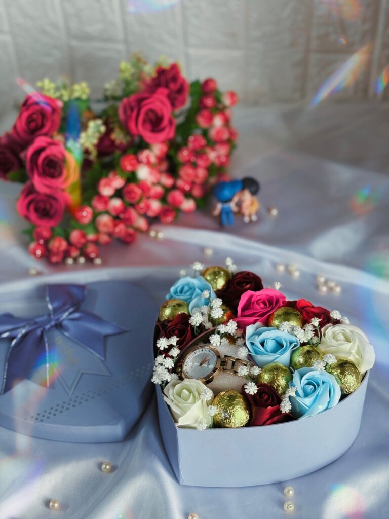 blue colour watch hamper with flowers and chocolates