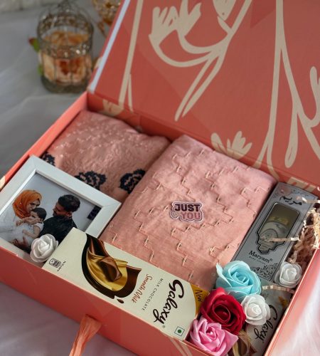 peach themed girlish luxury themed hamper with dress, frame, chocolates, flowers and perfume